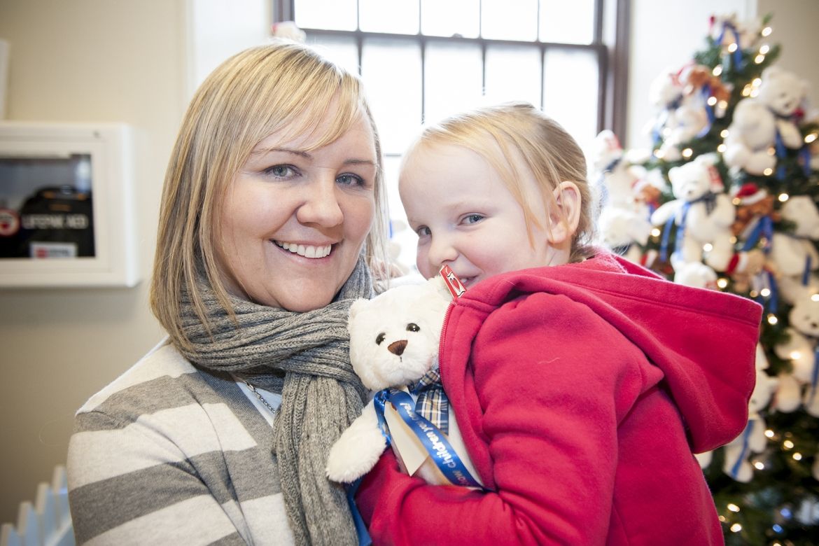 Five-year old patient Aly Davis and her mother Audrey Jones stopped by the Watkins lobby to help launch this year's "Show Children You Care" Teddy Bear campaign.