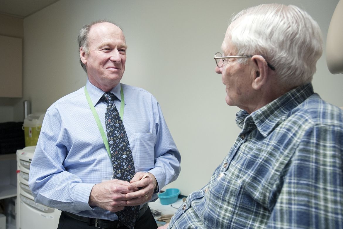 Doctor speaking with patient, follow up appointment, cancer care