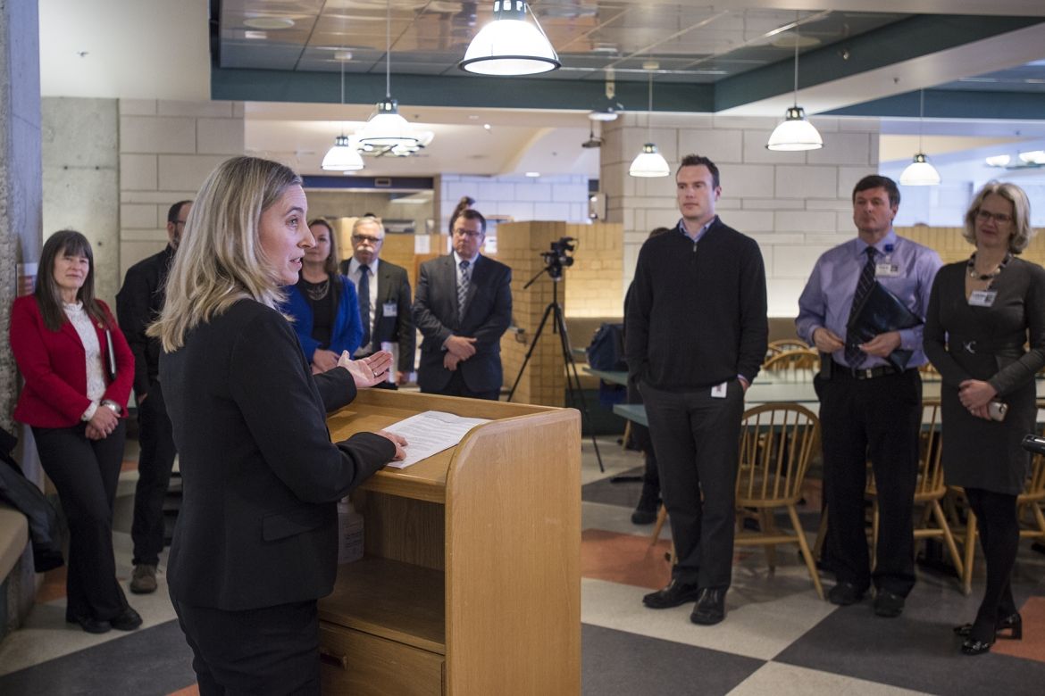 Community stakeholders and media gather for the energy savings event