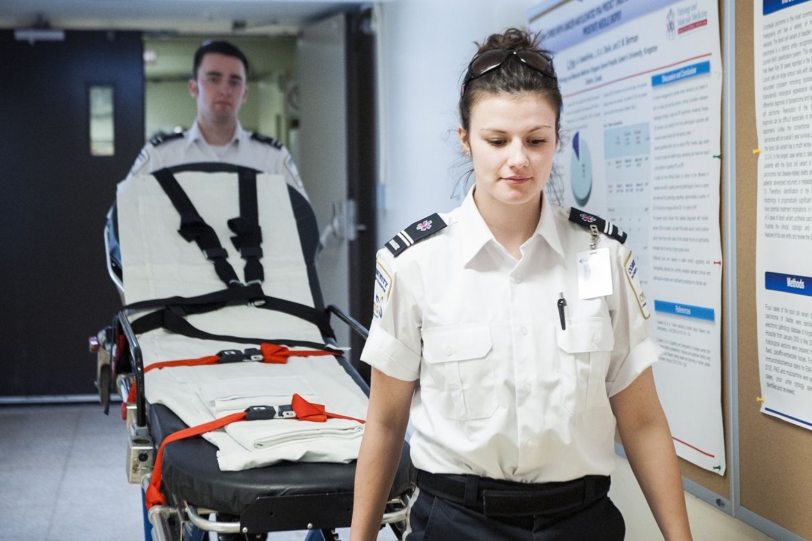 Community Patient Transfer Group Attendants Tyler Savage and Lindsay Raison prepare to pick up a patient in need of a non-urgent transfer from KGH.