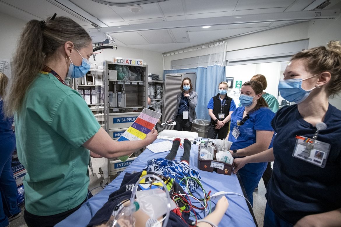 Members of a multidisciplinary team participate in simulation training in KHSC's Emergency Department, testing out the recently redesigned pediatric resuscitation carts
