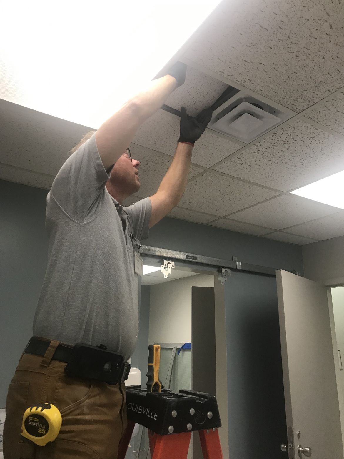 installing new ceiling tiles