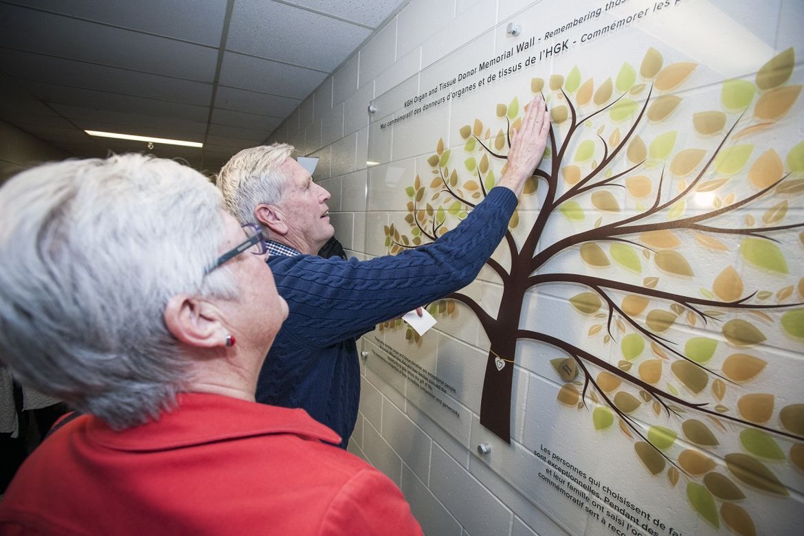 Family members were invited to place the names of their loved ones on the new memorial wall.