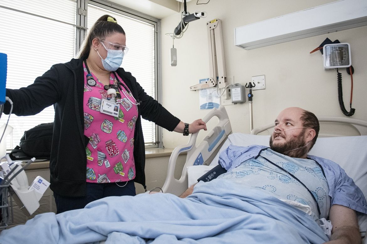 Allworth with nurse in KHSC Covid unit