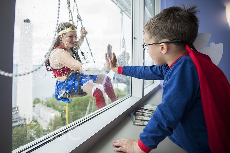 Superheroes from Elite Window Cleaning bring smiles to our youngest patients at our KGH site.
