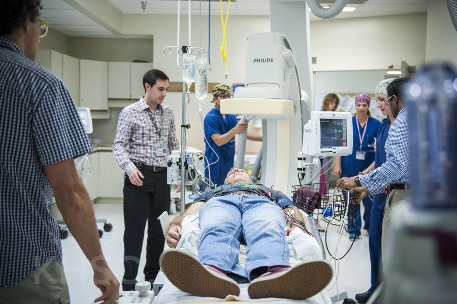 KHSC staff and physicians in an Interventional Radiology suite during an EVT simulation case