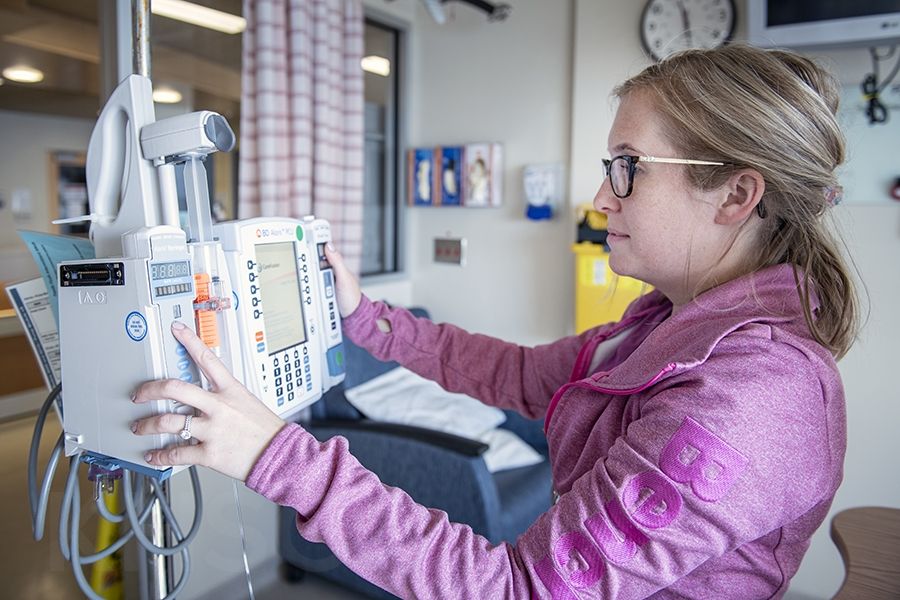 3096 - Jessica Amey, a Charge Nurse with the Pediatrics team prepares an infusion with one of the new syringe pumps.