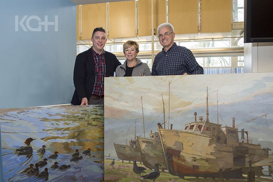 (Left) Tyler Hands, Program Manager of Inpatient and Ambulatory Oncology, thanks artist Robert Shackles and his wife Sylvia for their two big donations to our art collection.