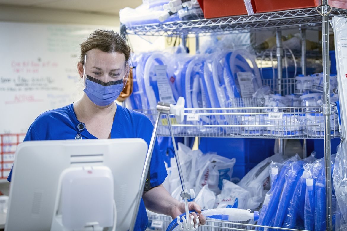 Respiratory Therapist Sarah Stanley prepares equipment for use in the ICU.