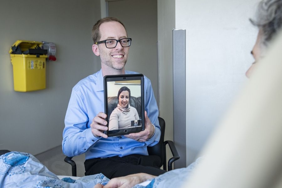 image of Spiritual Health Practitioner with iPad