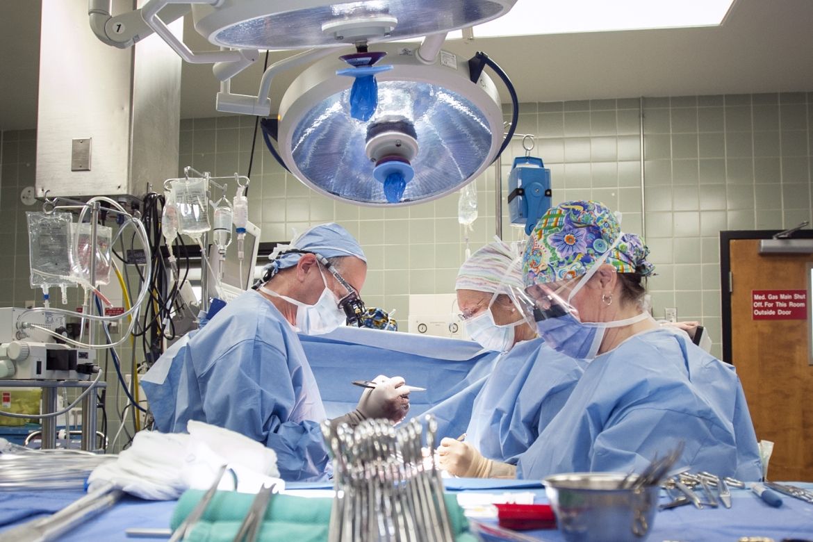 A multidisciplinary surgical care team working in the operating room at KGH.