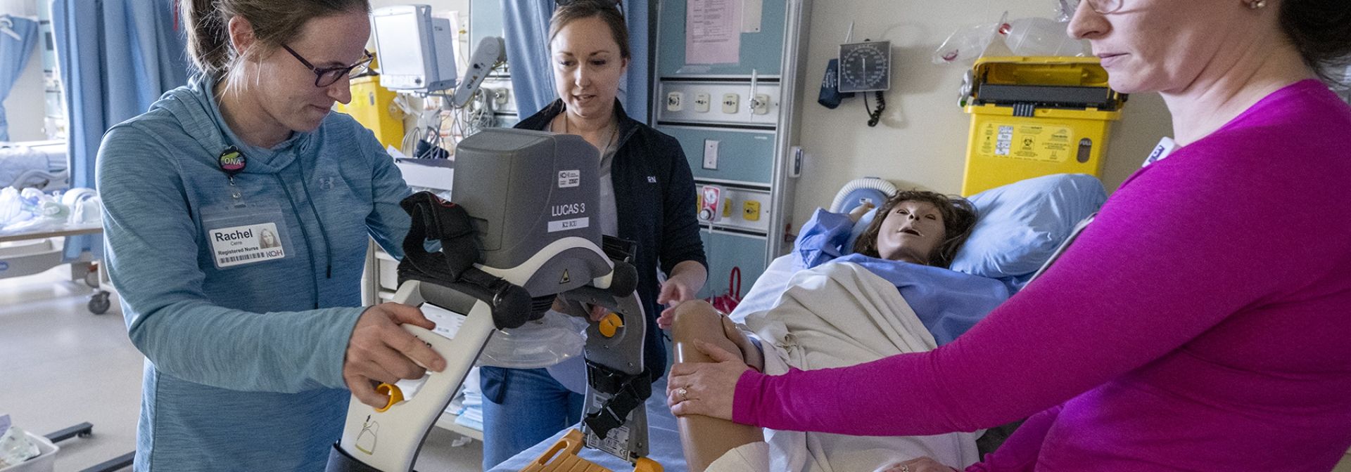 a group of nurses training at the bedside