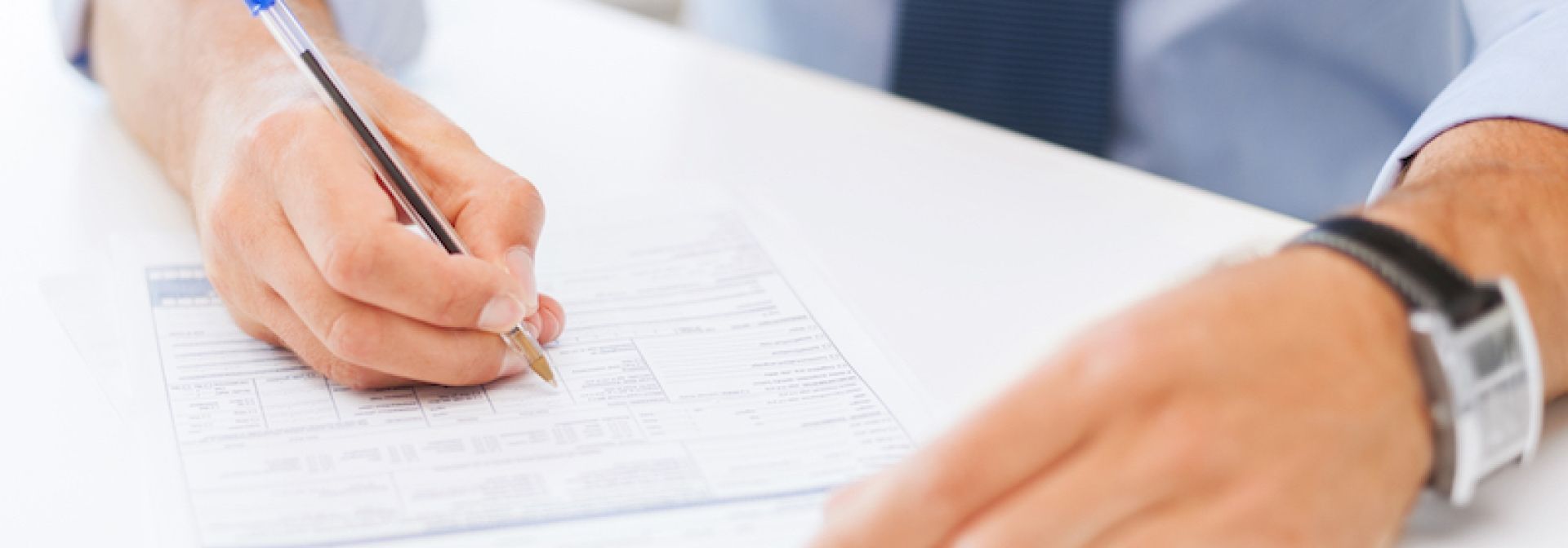 Man filling out form