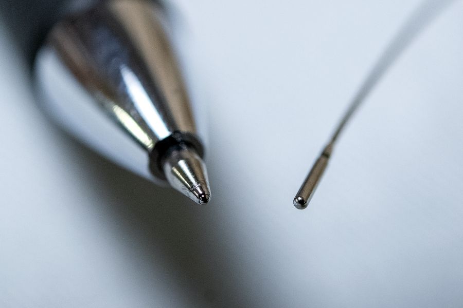 radioactive tool shown beside a pen for scale