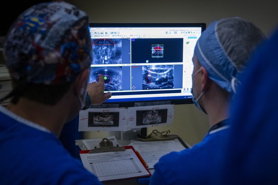 physicians looking at diagnostic imaging