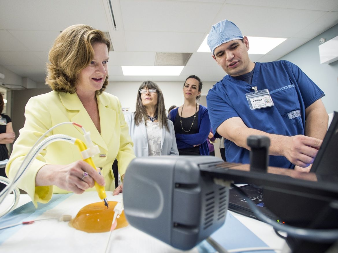 Karen Michell tries out a new piece of technology during the tour